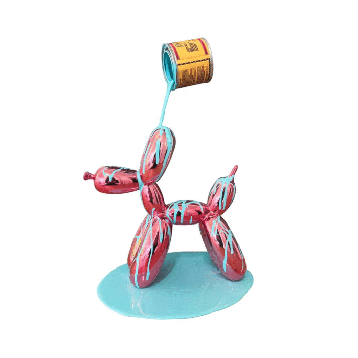 Pink and aqua Balloon Puppy sculpture by Joe Suzuki standing on a paint can.